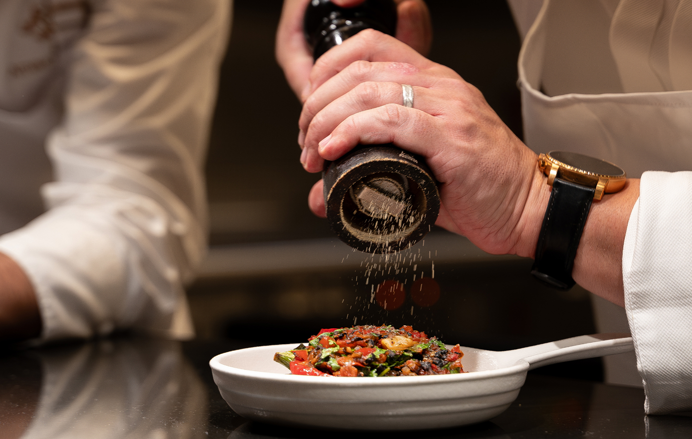 Chef seasoning dish